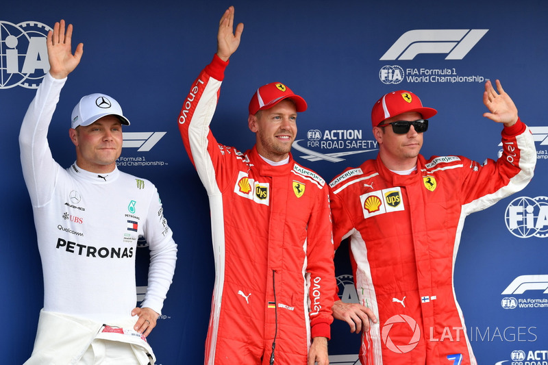 Valtteri Bottas, Mercedes-AMG F1, pole sitter Sebastian Vettel, Ferrari and Kimi Raikkonen, Ferrari celebrate in parc ferme