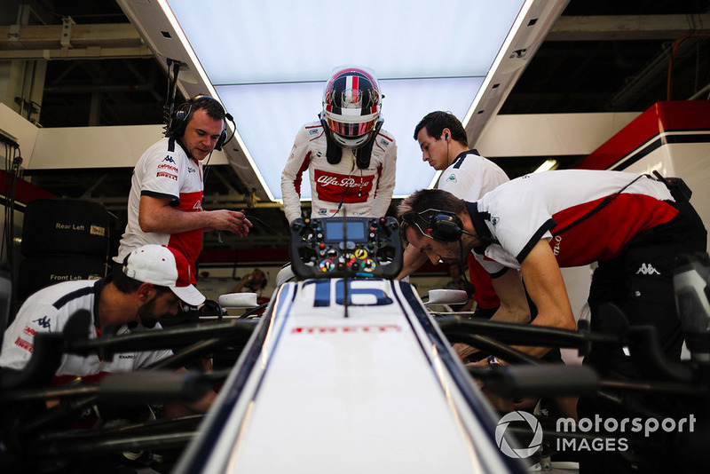 Charles Leclerc, Sauber, enters his cockpit.