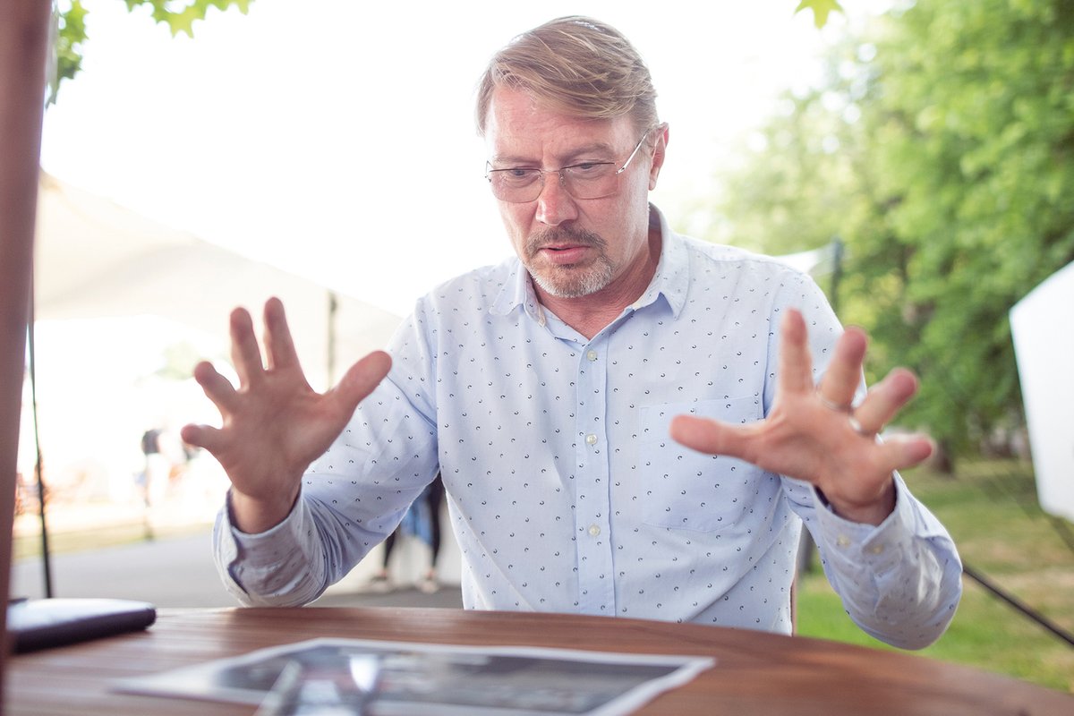 Hakkinen gets animated discussion his career in pictures with Maurice Hamilton