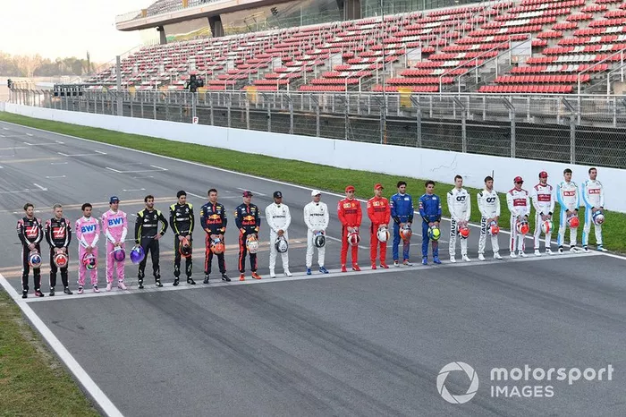 The drivers line up across the track