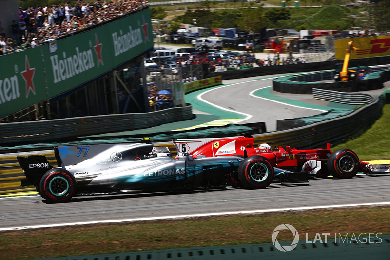 Sebastian Vettel, Ferrari SF70H, passes Valtteri Bottas, Mercedes AMG F1 W08, at the start