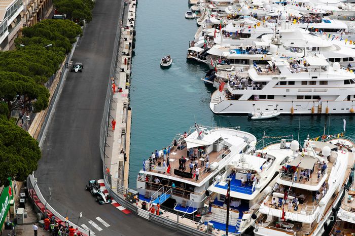 Nico Rosberg leads his father Keke Rosberg as they tour the circuit in their world title winning cars