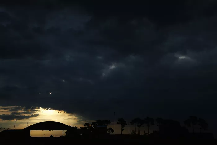 Car drives under the Dunlop Bridge at sunrise