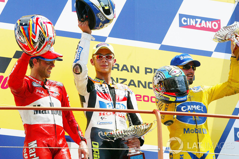 Podium: winner Valentino Rossi, second place Loris Capirossi, third place Max Biaggi