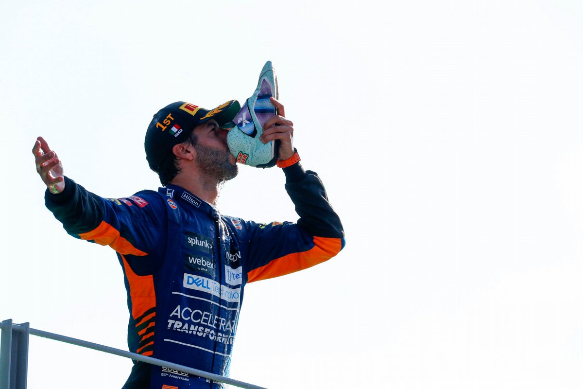 Daniel Ricciardo, McLaren, 1st position, performs a shoey on the podium