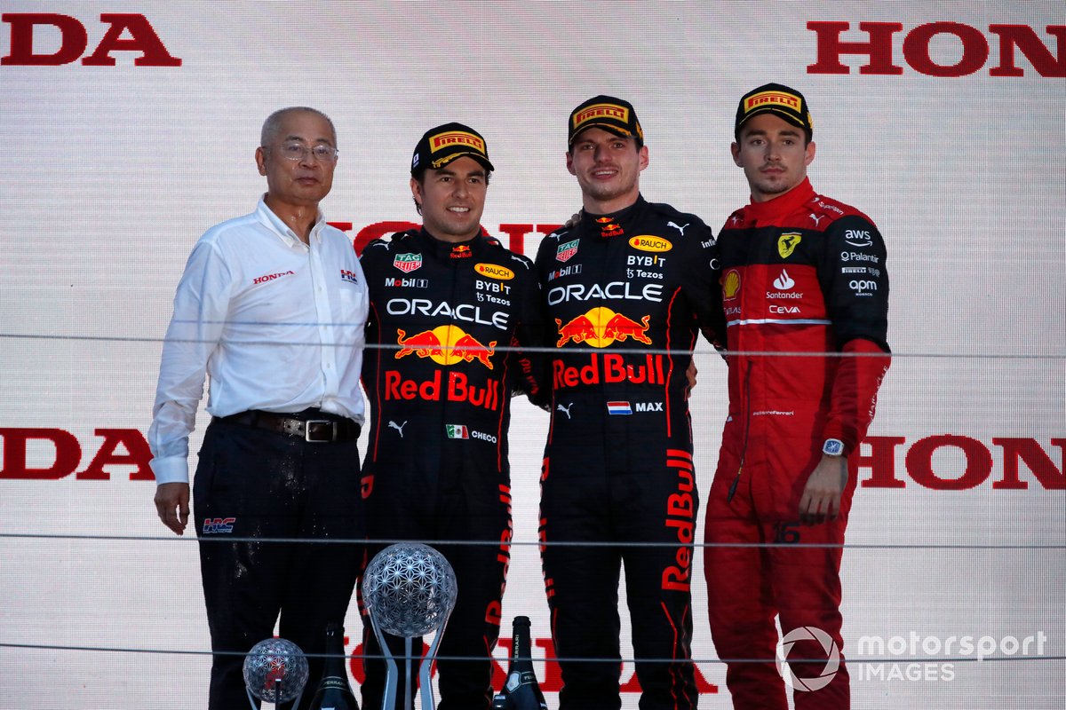 The Honda constructors trophy delegate, Sergio Perez, Red Bull Racing, 2nd position, Max Verstappen, Red Bull Racing, 1st position, Charles Leclerc, Ferrari, 3rd position, on the podium