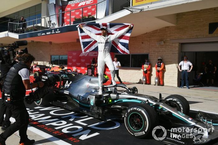 Lewis Hamilton, Mercedes AMG F1, 2nd position, celebrates with a Union flag after securing his sixth drivers world championship title