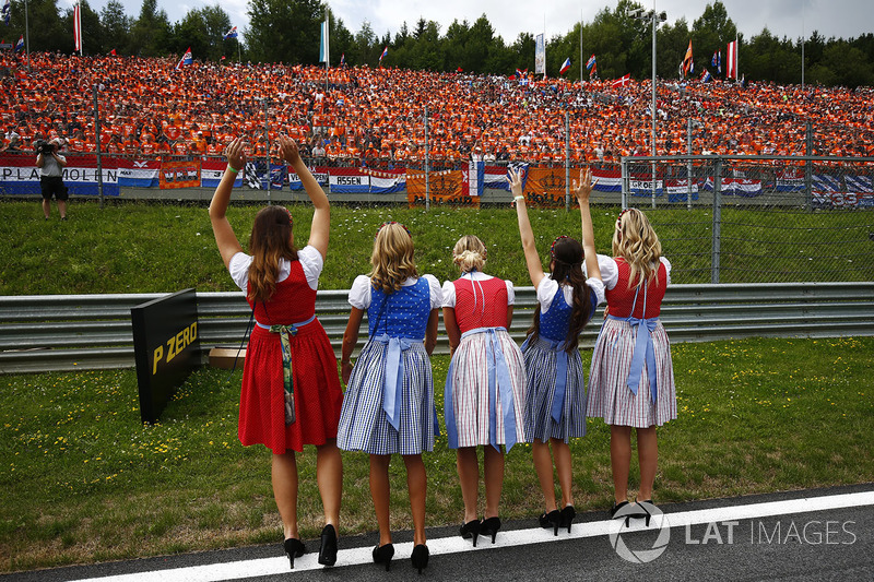 Austrian promotional girls wave to fans