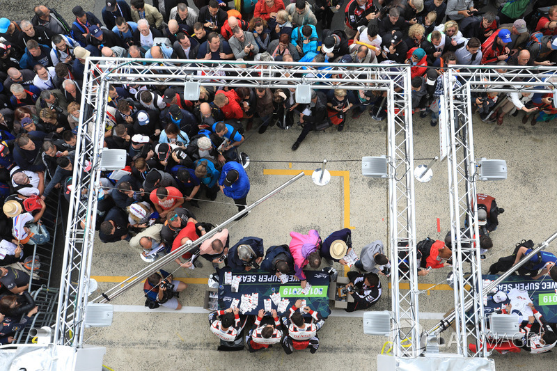 Fans surround the Toyota Gazoo Racing autograph table