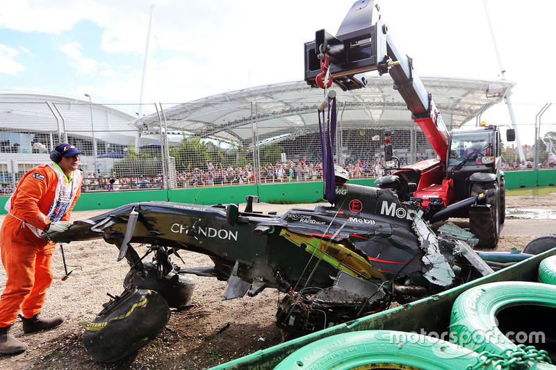 The McLaren MP4-31 of Fernando Alonso, McLaren is removed from the gravel trap after his race stopping crash