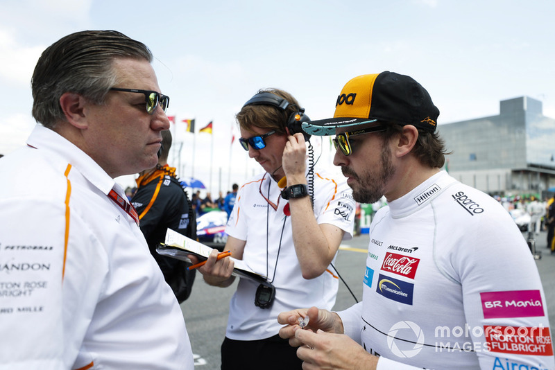 Zak Brown, Executive Director, McLaren Racing, and Fernando Alonso, McLaren, on the grid