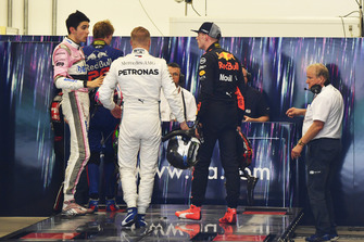 Max Verstappen, Red Bull Racing and Esteban Ocon, Racing Point Force India square up after the race following their on track crash