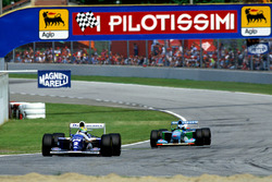 Ayrton Senna, Williams FW16, leads Michael Schumacher, Benetton B194