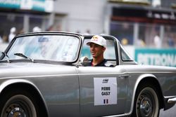 Pierre Gasly, Reserve Driver, Scuderia Toro Rosso, rides in a Triumph TR on the drivers parade