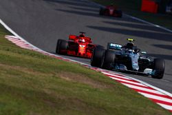 Valtteri Bottas, Mercedes AMG F1 W09, leads Sebastian Vettel, Ferrari SF71H, and Kimi Raikkonen, Ferrari SF71H