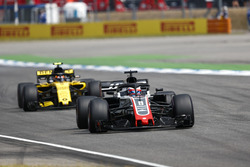 Romain Grosjean, Haas F1 Team VF-18, leads Carlos Sainz Jr., Renault Sport F1 Team R.S. 18