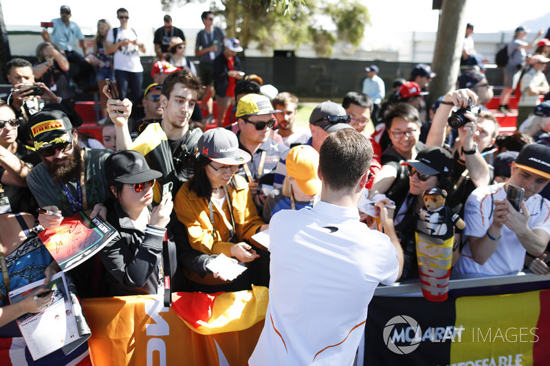 Stoffel Vandoorne, McLaren, signs autographs for fans