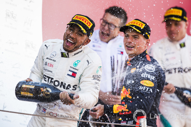 Lewis Hamilton, Mercedes AMG F1, 1st position, Max Verstappen, Red Bull Racing, 3rd position, celebrate with Champagne on the podium