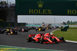 Sebastian Vettel, Ferrari SF71H and Kimi Raikkonen, Ferrari SF71H battle at the start of the race