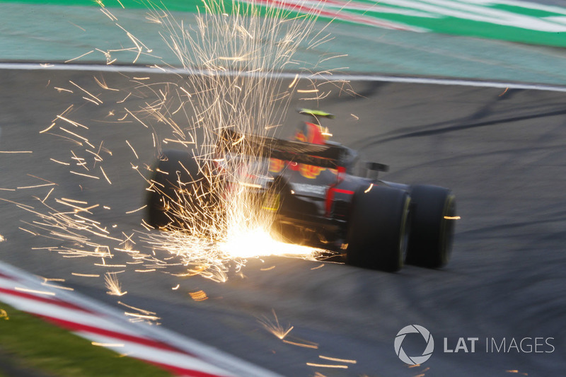 Sparks fly from the car of Max Verstappen, Red Bull Racing RB14 Tag Heuer