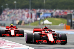 Sebastian Vettel, Ferrari SF71H, leads Kimi Raikkonen, Ferrari SF71H