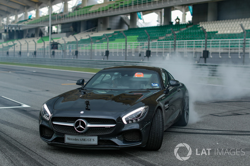 Lewis Hamilton, Mercedes AMG F1 in a Mercedes AMG GTS