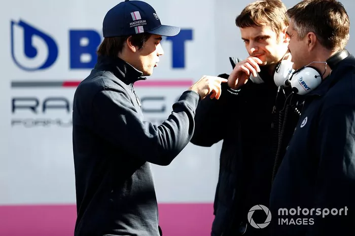 Lance Stroll, Racing Point talks to members of the team