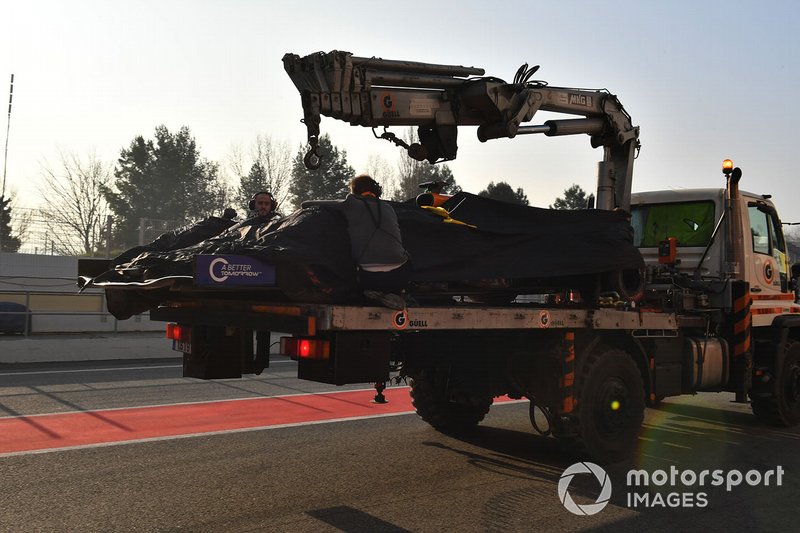 The car of Lando Norris, McLaren is recovered to the pits