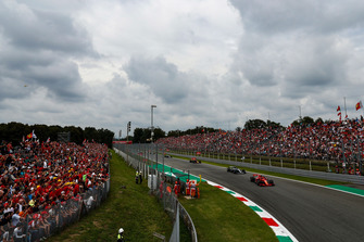 Kimi Raikkonen, Ferrari SF71H, leads Lewis Hamilton, Mercedes AMG F1 W09, and Max Verstappen, Red Bull Racing RB14