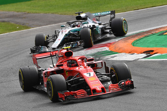 Kimi Raikkonen, Ferrari SF71H leads Lewis Hamilton, Mercedes AMG F1 W09