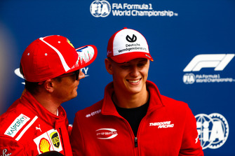Mick Schumacher presents Kimi Raikkonen, Ferrari, with the Pirelli Pole Position award