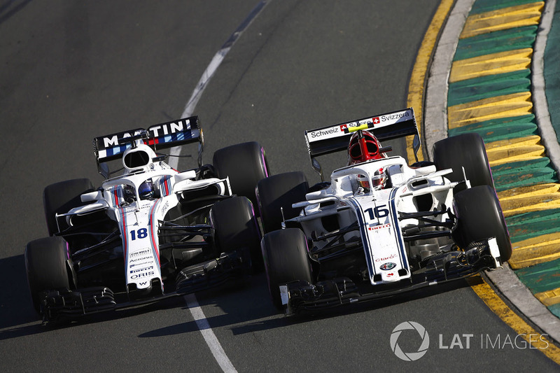 Charles Leclerc, Sauber C37 Ferrari, battles with Lance Stroll, Williams FW41 Mercedes