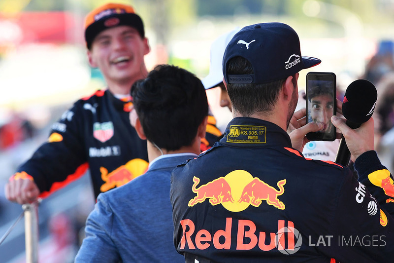 Daniel Ricciardo, Red Bull Racing celebrates with his phone on the podium