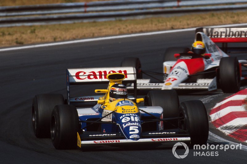 Il vincitore della gara Thierry Boutsen, Williams precede Ayrton Senna, McLaren