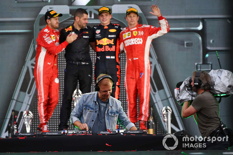 (L to R): Sebastian Vettel, Ferrari, Guillaume Rocquelin, Red Bull Racing Race Engineer, Max Verstappen, Red Bull Racing and Kimi Raikkonen, Ferrari celebrate on the podium and Armin van Buuren, DJ 