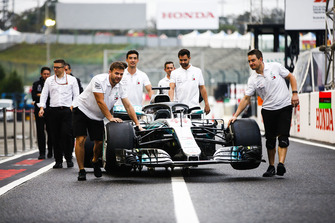 Lewis Hamilton's Mercedes AMG F1 W09 EQ Power+ heads for scrutineering in the pit lane