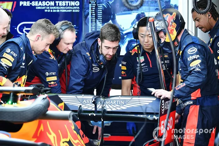 Team members examine Red Bull Racing RB16