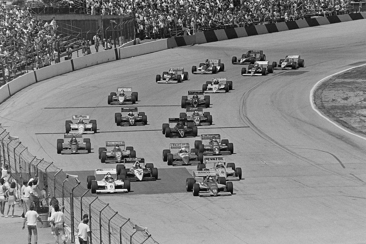 1988 Milwaukee – Rick Mears (car #5) chases polesitter Michael Andretti (#18) and fellow front-row starter Mario Andretti (#6). Mears would go on to score his second of three victories. 