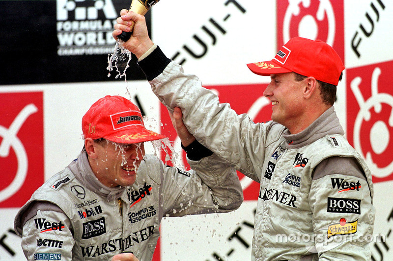 Podium:  David Coulthard and Mika Hakkinen celebrate