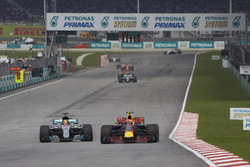 Max Verstappen, Red Bull Racing RB13, passes Lewis Hamilton, Mercedes AMG F1 W08