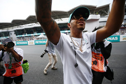 Lewis Hamilton, Mercedes AMG F1, is photographed waving to fans