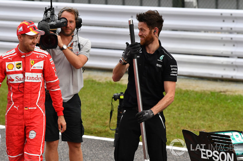 Sebastian Vettel, Ferrari and Mercedes AMG F1 mechanic in parc ferme