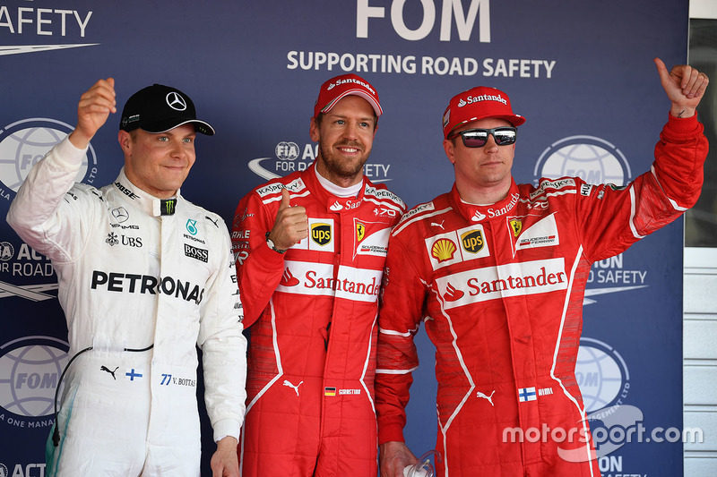 Polesitter Sebastian Vettel, Ferrari, second place Kimi Raikkonen, Ferrari, third place Valtteri Bot