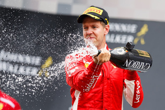 Sebastian Vettel, Ferrari celebrates on the podium with the champagne