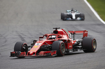 Sebastian Vettel, Ferrari SF71H, leads Lewis Hamilton, Mercedes AMG F1 W09
