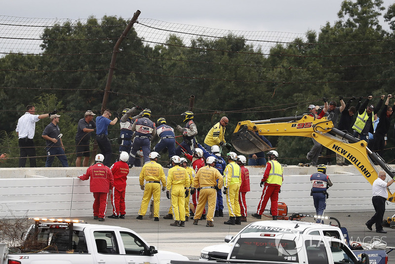 IndyCar officials at the site of the crash