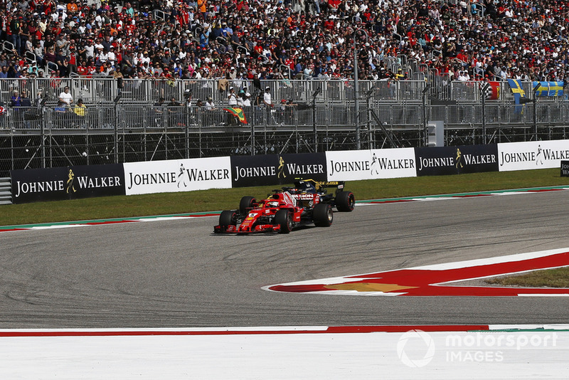 Sebastian Vettel, Ferrari SF71H and Carlos Sainz Jr., Renault Sport F1 Team R.S. 18 battle