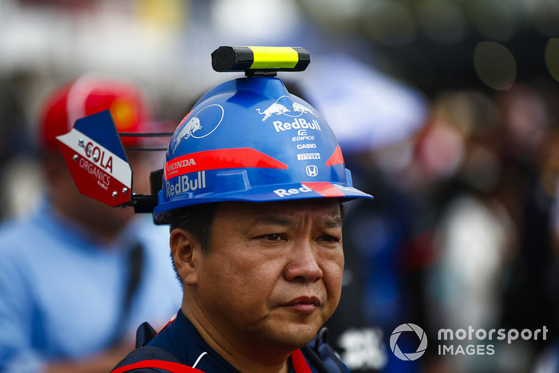 A fan with a custom made Toro Rosso Honda hat