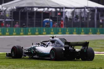 Valtteri Bottas, Mercedes AMG F1 W09 EQ Power+, heads across the grass
