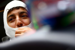 Daniel Ricciardo, Red Bull Racing sits in his car in the garage